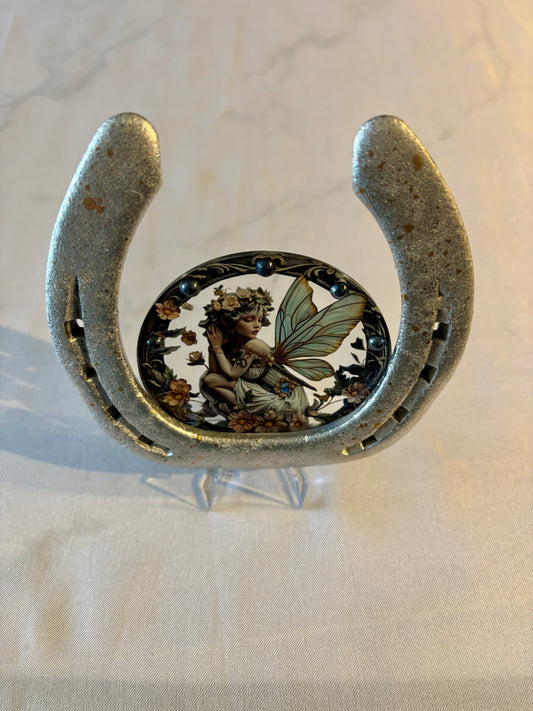 fer à cheval et sa petite fée