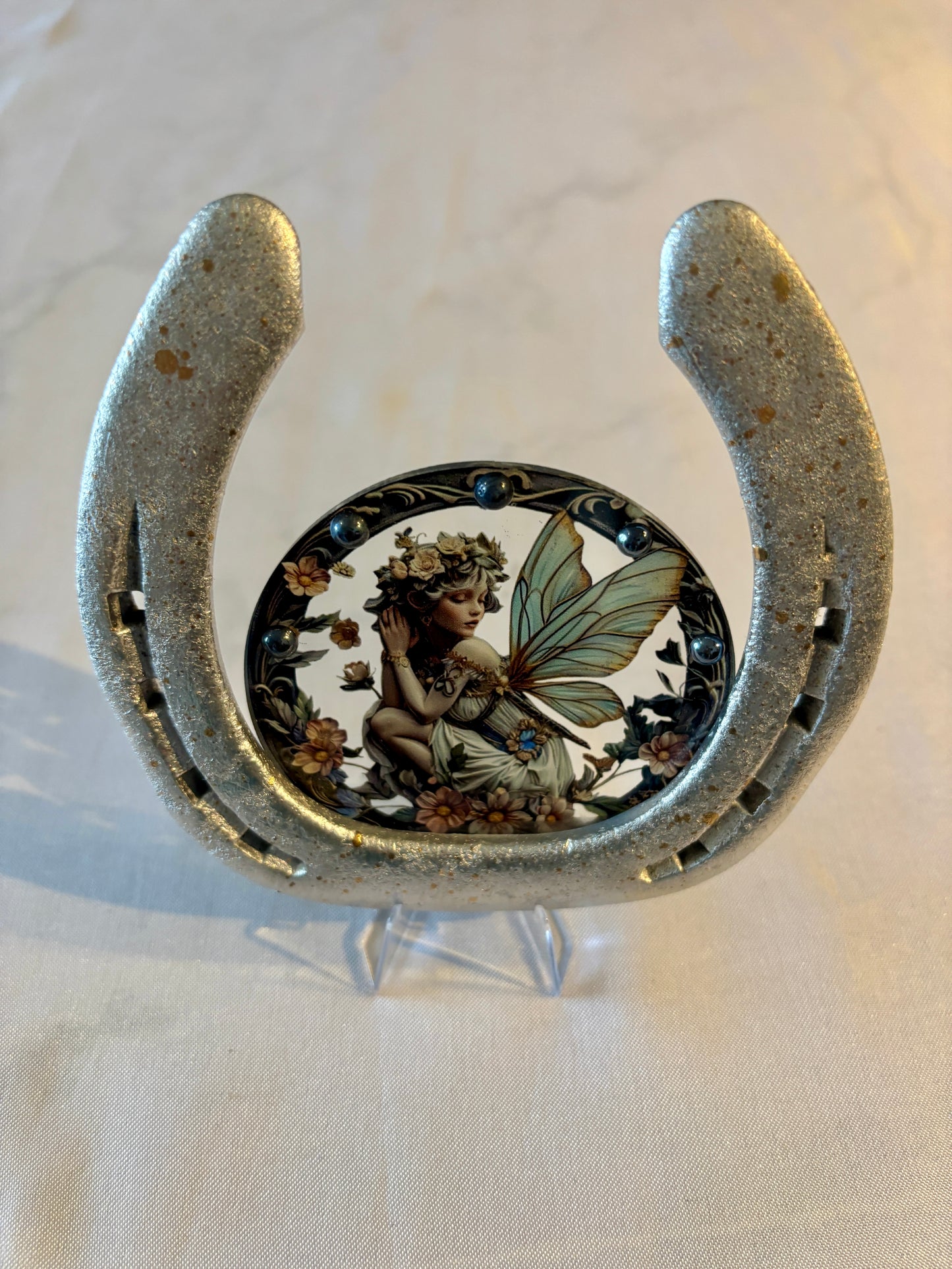 fer à cheval et sa petite fée